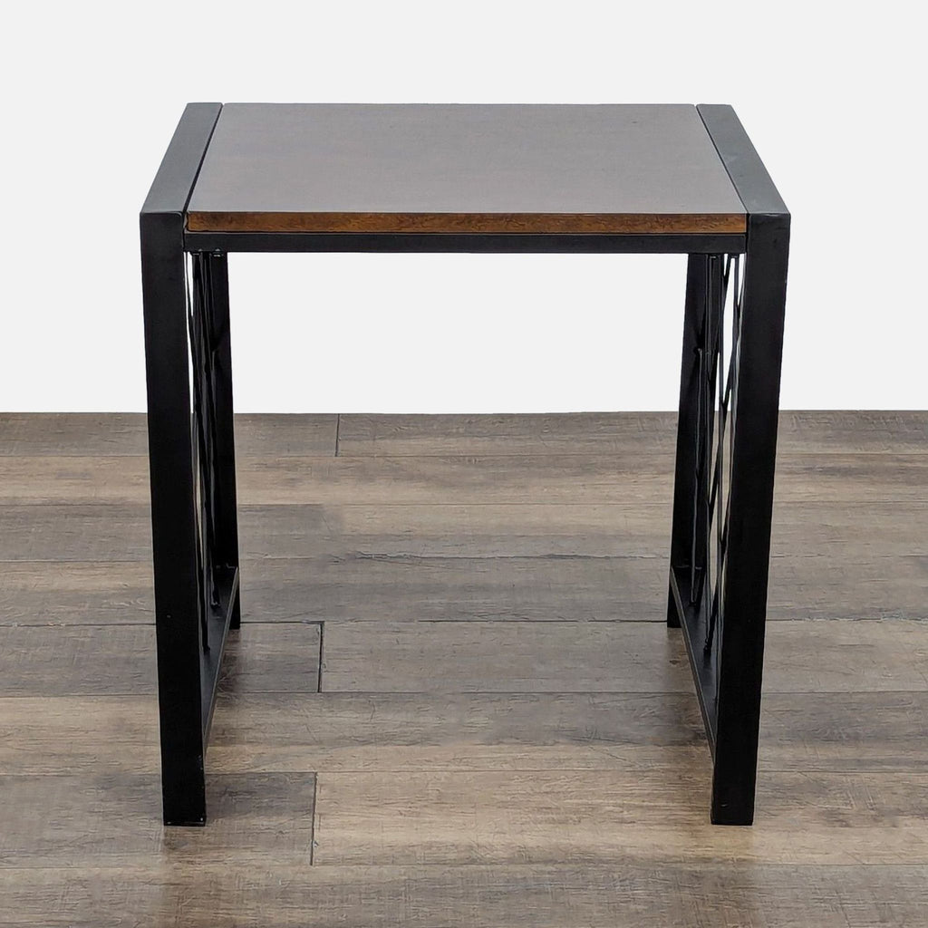 2. Modern end table from Ashley Furniture, square wood surface and black metal legs with geometric lattice pattern.  