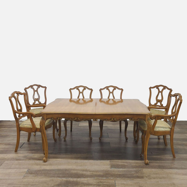 1. Reperch dining set with carved wood table, four upholstered side chairs, and two arm chairs.