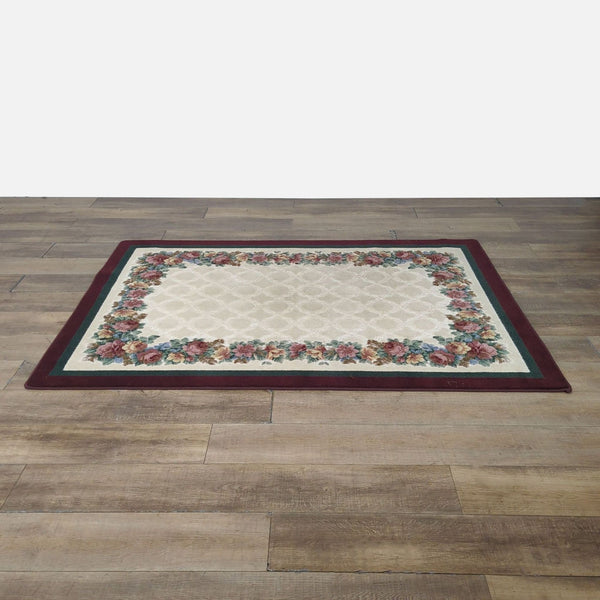 1. Reperch multi-color Persian style rug with floral border and carved effect, shown laid on wooden floor.