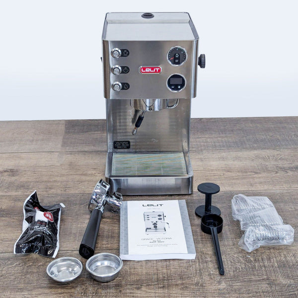 1. Front view of the Lelit Victoria PL91T espresso machine with included accessories on a wood surface.