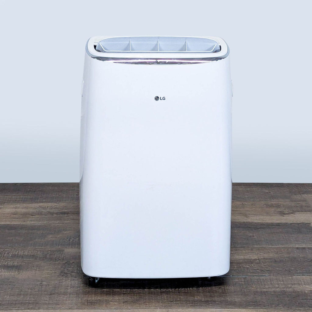 1. Front view of a white LG portable air conditioner with modern design, suitable for small to medium rooms.