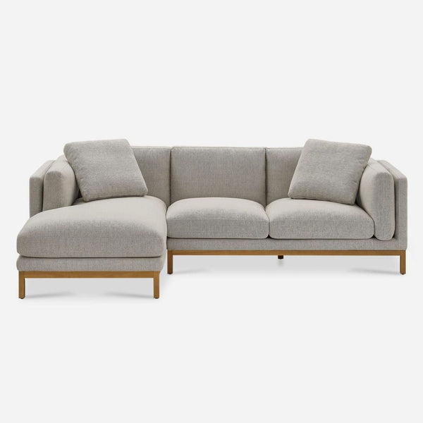 1. Castlery sectional with curved plush cushions and a squared frame, shown from the front with two pillows.
