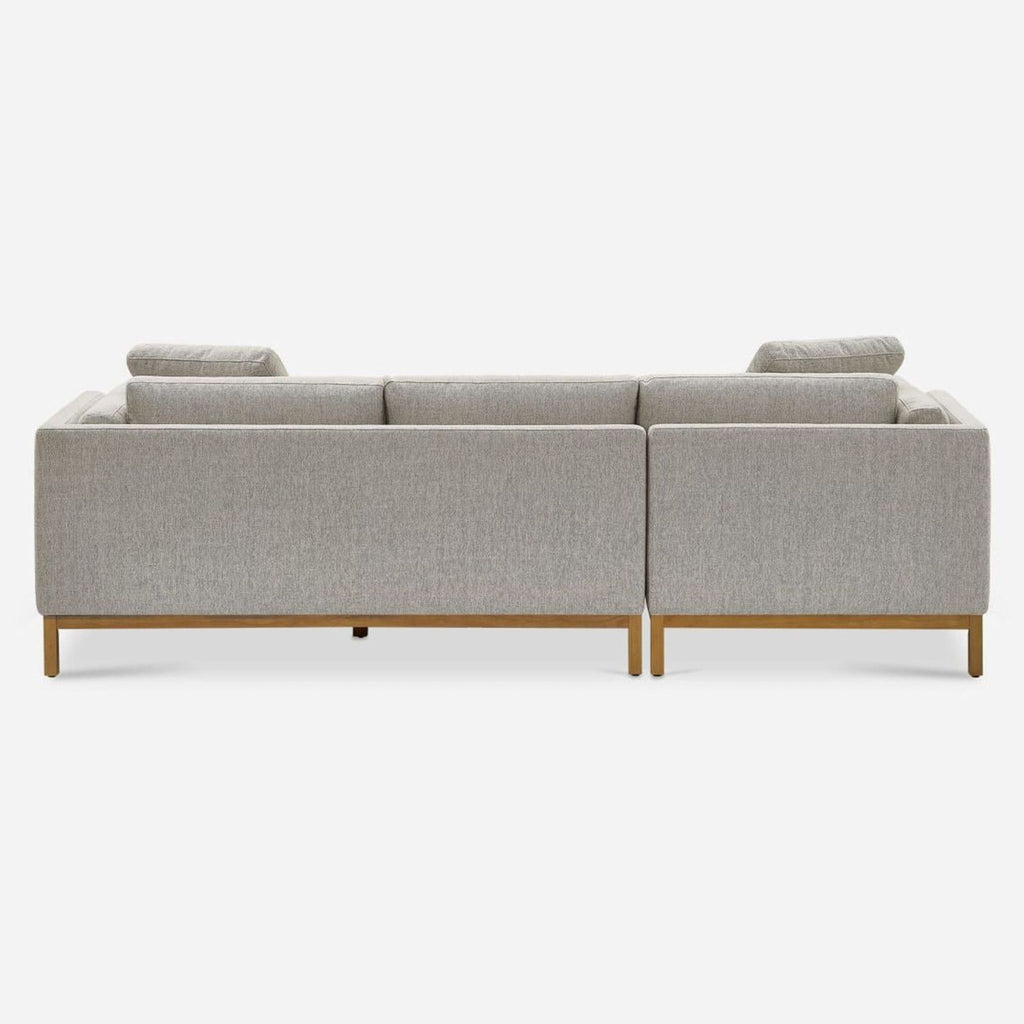 3. Back view of Castlery sectional sofa, highlighting the squared frame and neutral fabric upholstery.