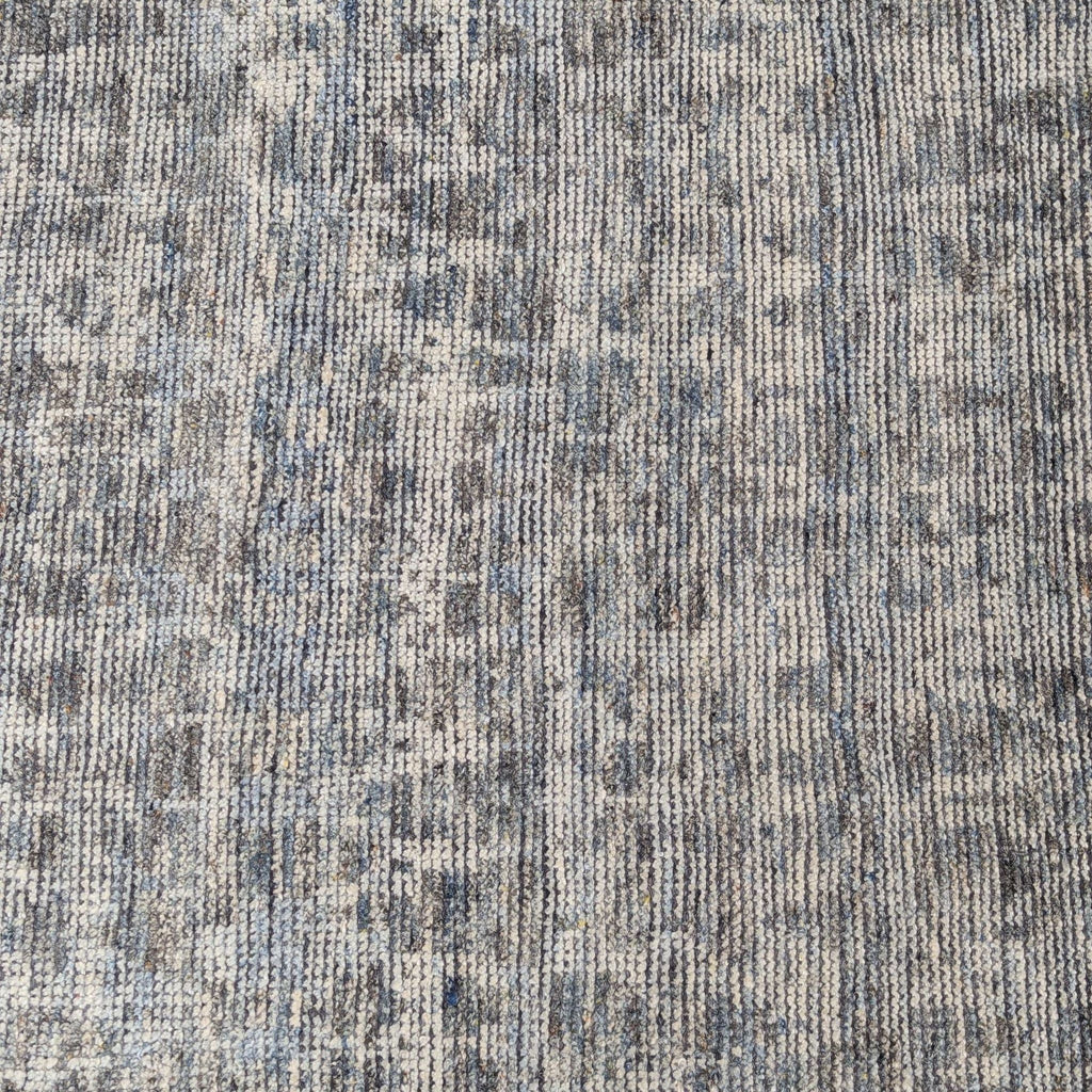 3. Detailed view of Loloi hand-knotted wool rug, showing blue-gray pattern and fine woven texture.
