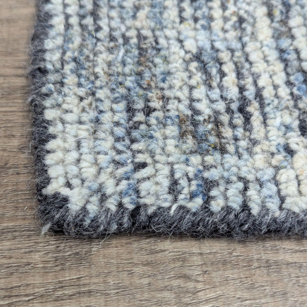 2. Close-up of Loloi Rugs' hand-knotted wool rug corner, highlighting the thick, textured weave.