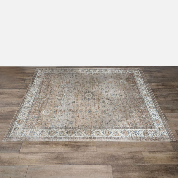 1. Reperch polyester rug with a vintage floral border design, shown on wooden floor, machine washable and non-slip.