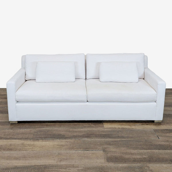 1. White Restoration Hardware loveseat with deep seat, track arms, and wood block feet viewed from the front.