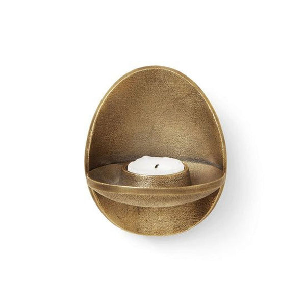 Bronze finished recycled cast aluminum tea light holder by Ferm Living, with a single white candle.  