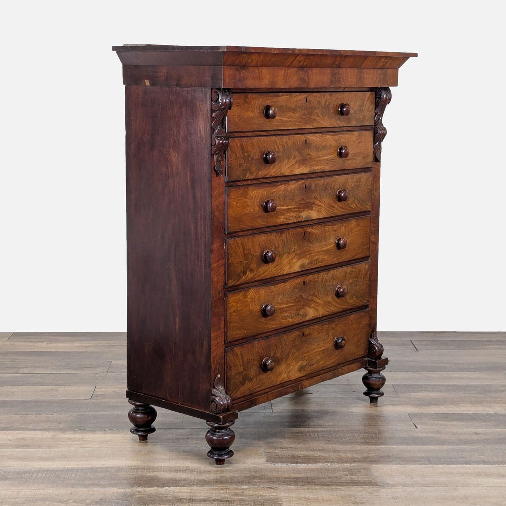 3. Angled view of Reperch dresser, featuring carved legs, six drawers with dovetail joinery and wood knobs.