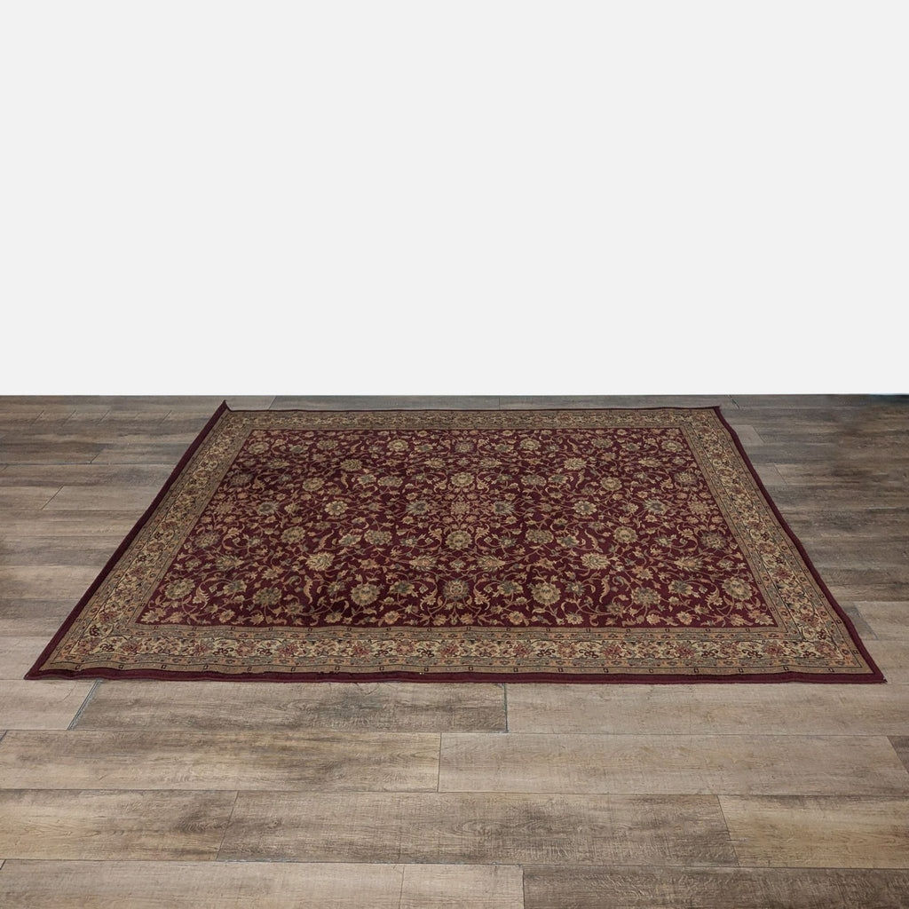 1. Burgundy area rug with an intricate floral pattern, placed on a wooden floor, from Shawh brand.