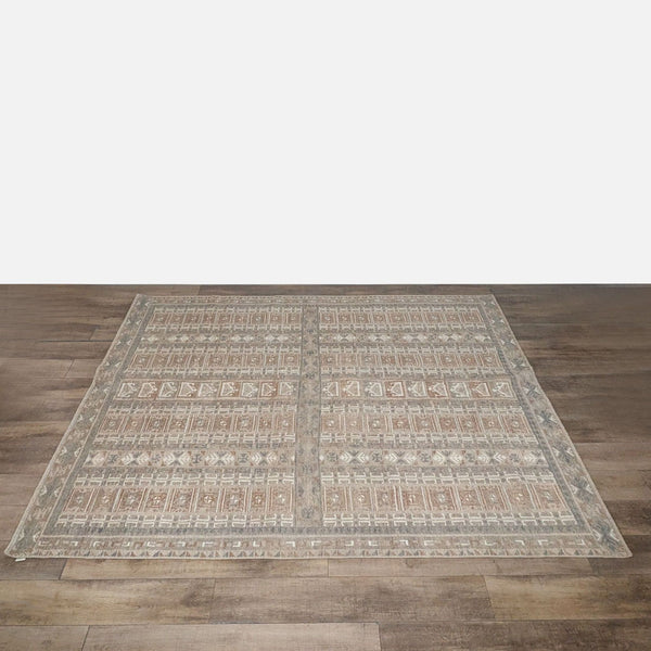 A large rectangular Citizenry rug with intricate geometric patterns, handwoven from 100% New Zealand wool.  