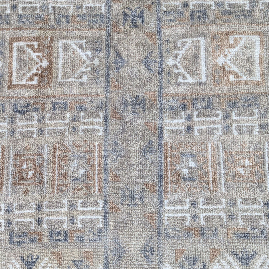Detailed view of patterned Citizenry rug surface, highlighting the handwoven geometric motifs and soft neutral colors.