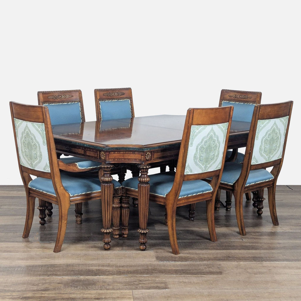 1. Octagonal Reperch dining set with a dark wood carved table, six blue-upholstered chairs, and patterned backs.