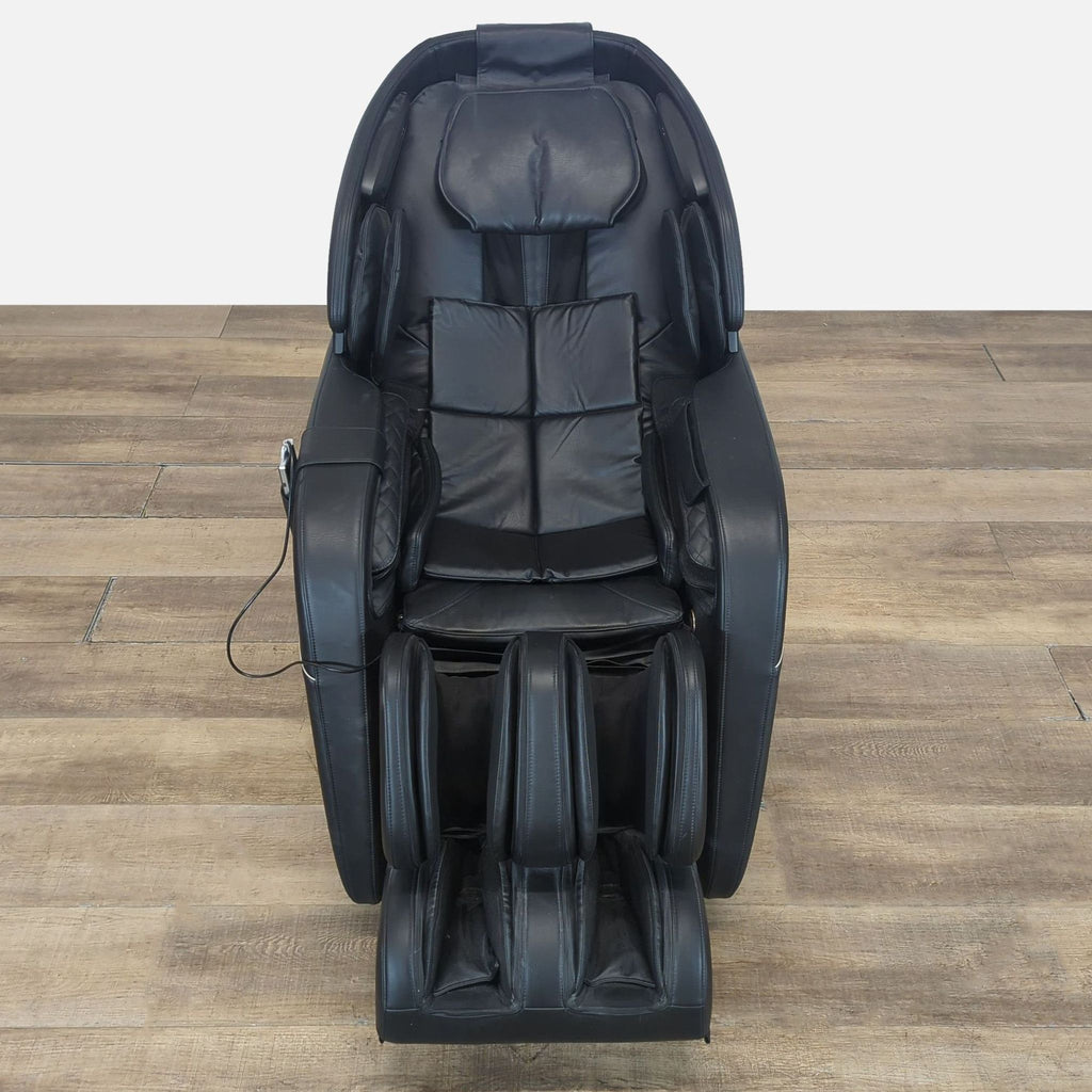 1. Black Daiwa Legacy 4 massage chair with multiple pads, 3D rollers, and extendable leg rest on wooden floor.