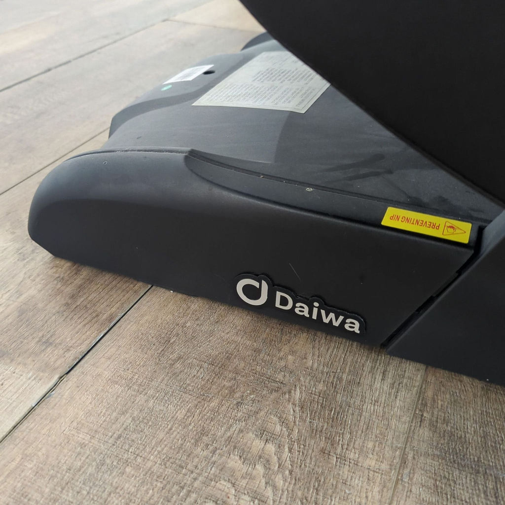 3. Close-up of the Daiwa Legacy 4 massage chair base, highlighting brand logo and sturdy construction.