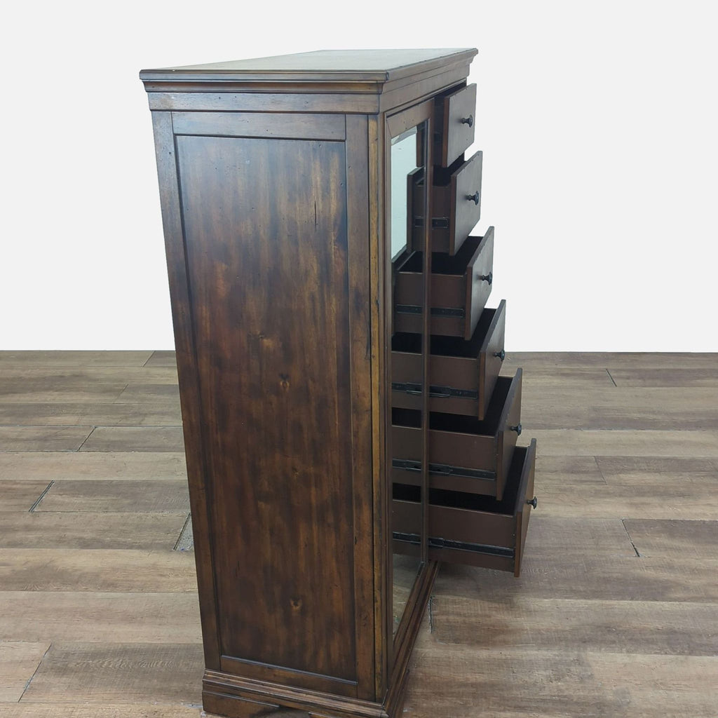 3. Side view of Klaussner solid wood dresser showing six open drawers and sliding mirror feature.