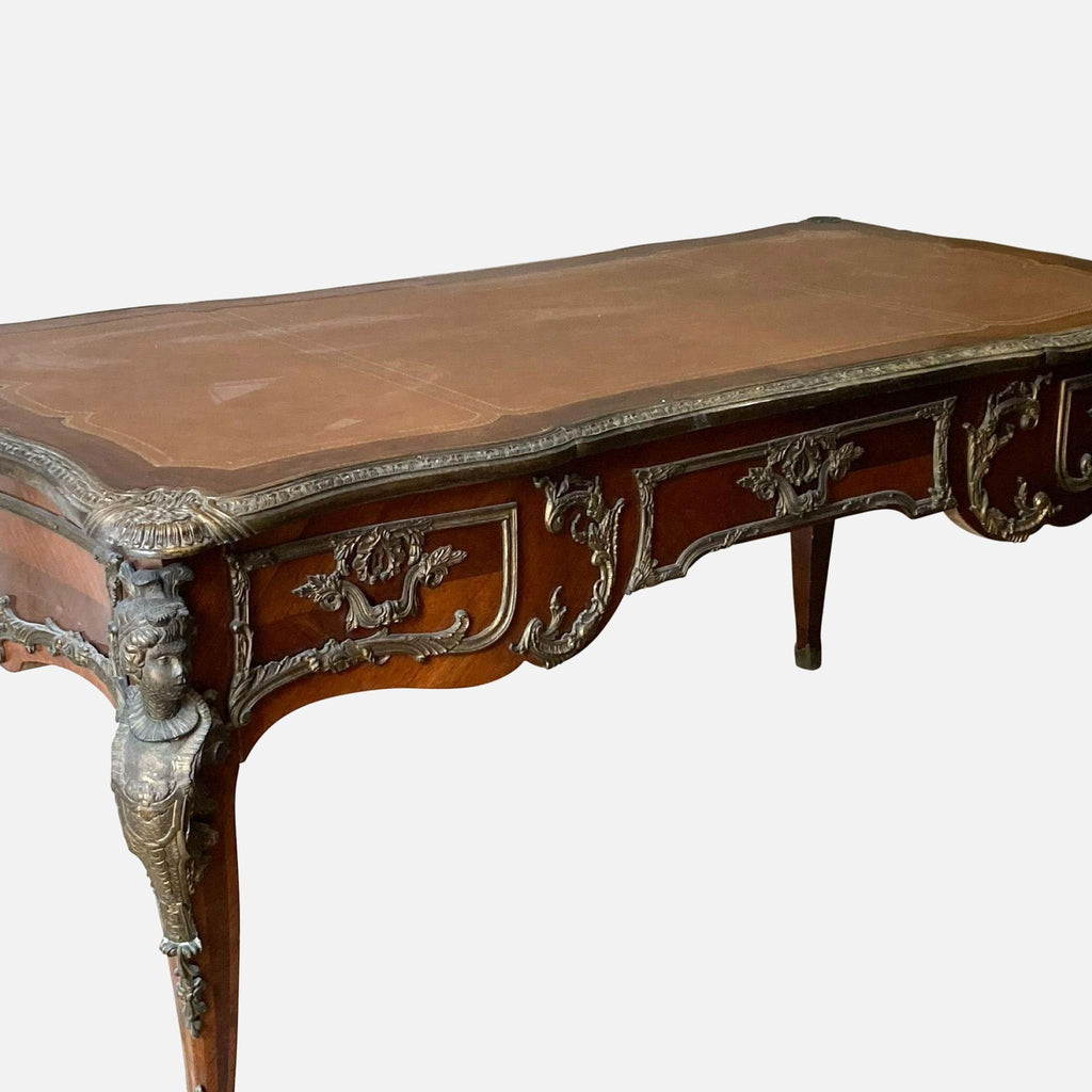 1. Antique French-style wooden desk with ornate bronze accents, detailed carvings, and a leather inlay top.