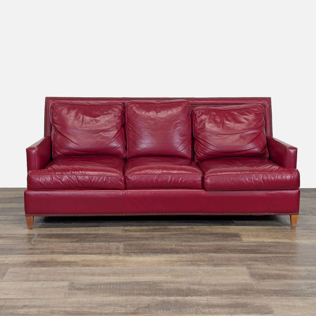 1. Red Hancock & Moore 3-seat sofa with track arms, nailhead trim, loose cushion backs, and tapered wood feet.