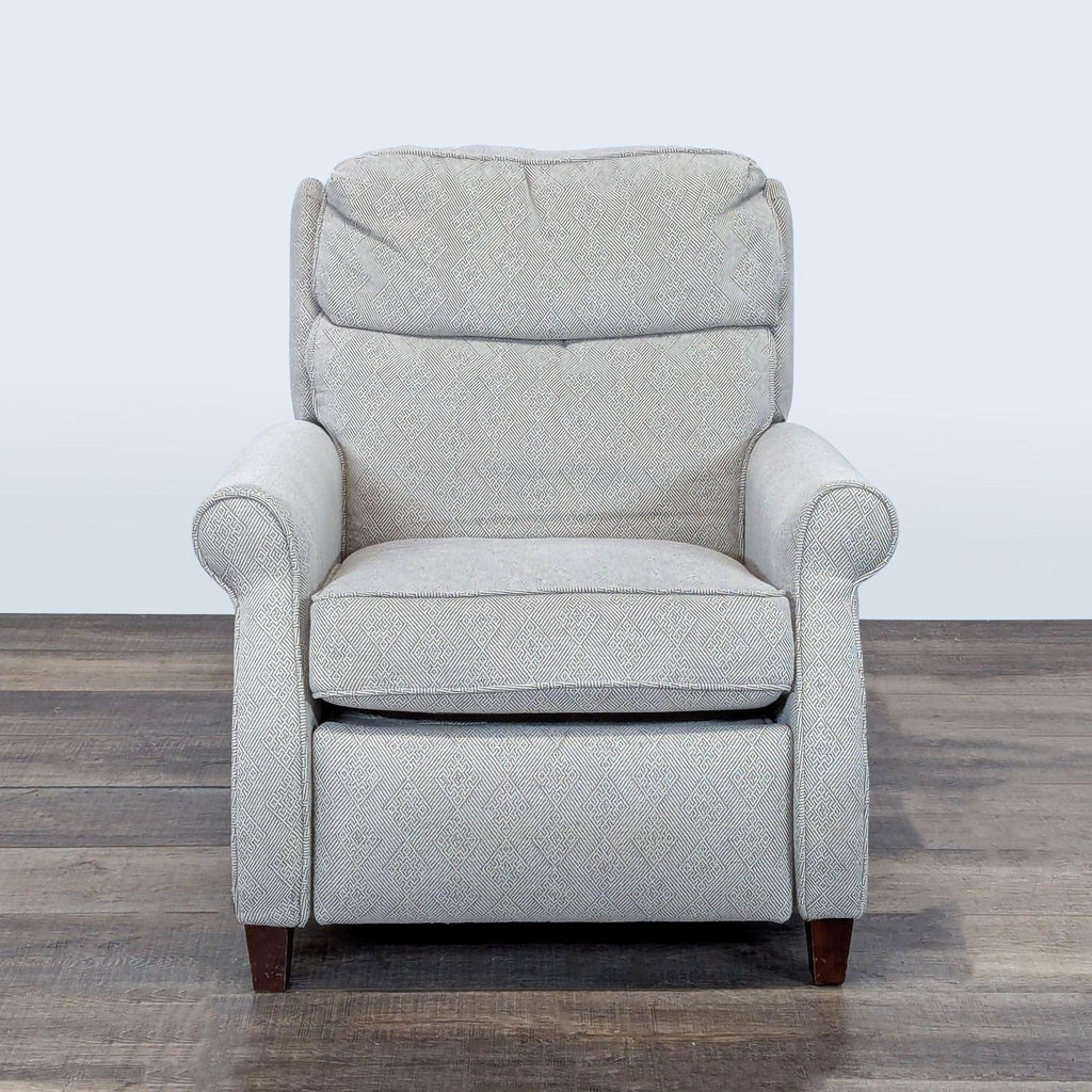 1. Front view of a Comfort Design lounge recliner with rolled arms, punch back recline, and adjustable headrest.