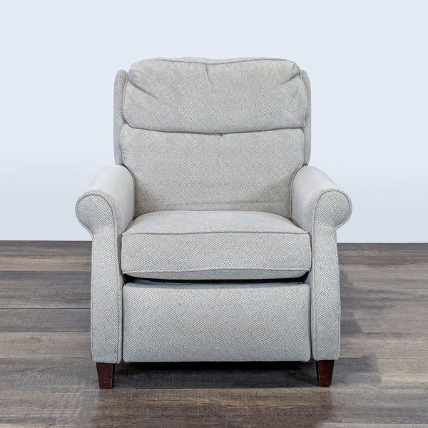 1. Front view of a Comfort Design lounge recliner with rolled arms, punch back recline, and adjustable headrest.