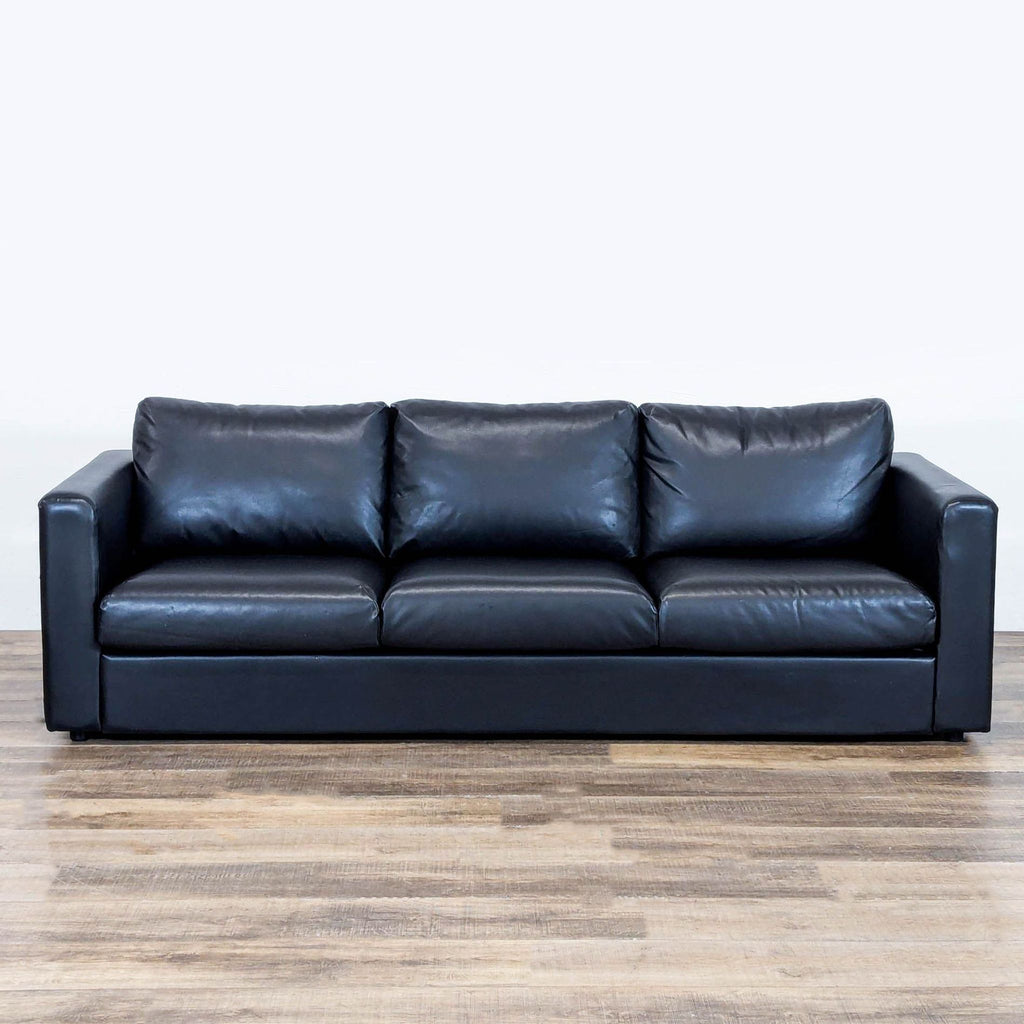 1. Black leather Ikea 3-seat sofa with pocket spring cushions, high resilience foam, and wadding, front view.