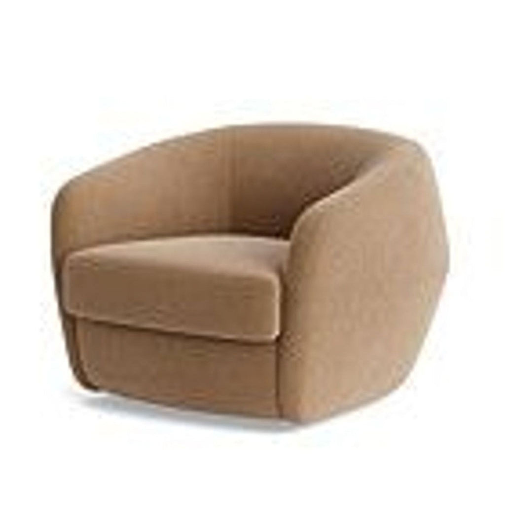 Angled view of BenchMade Modern lounge chair, featuring velvet upholstery and a rounded barrel back.