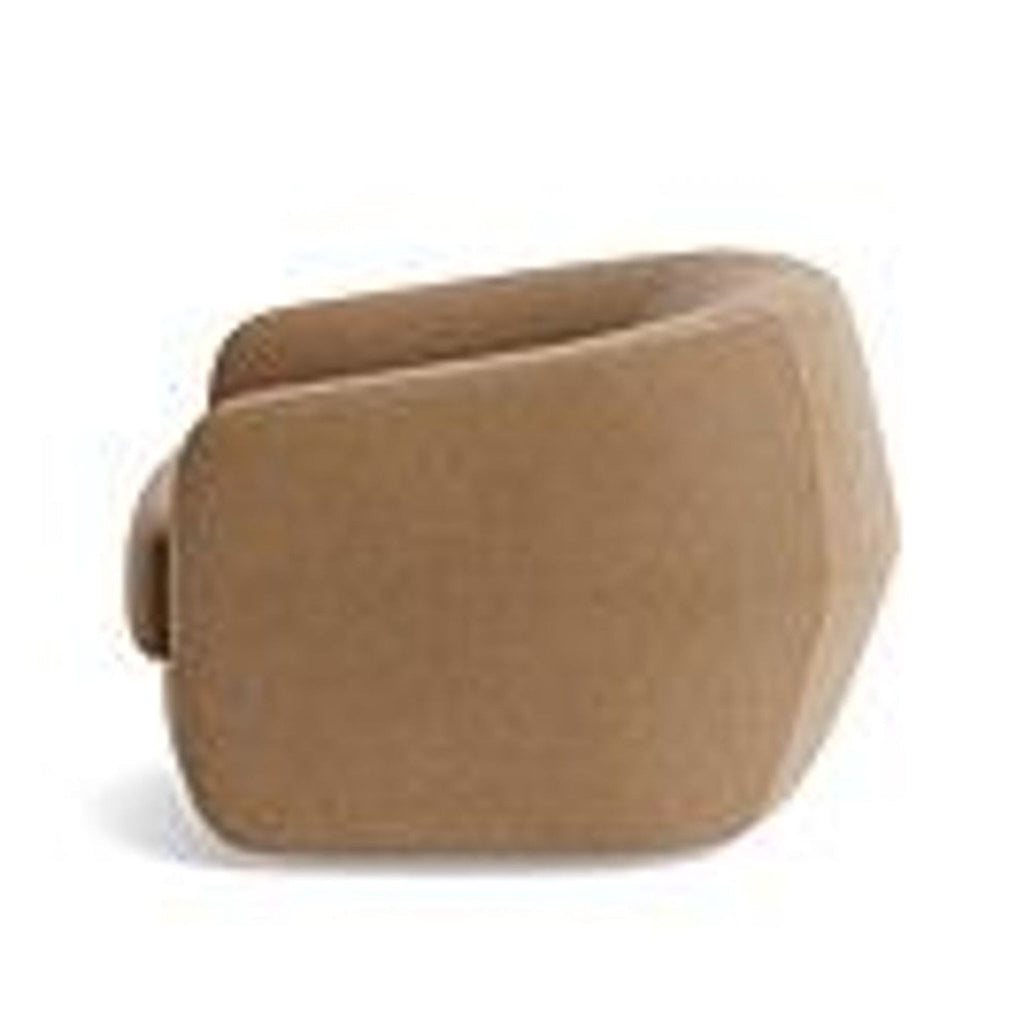 3. Rear angle of a BenchMade Modern lounge chair, showing curved velvet upholstery and barrel back.