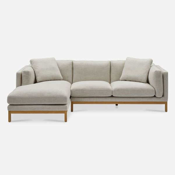1. Castlery sectional with a wood frame, plush light cushions, and a right chaise, shown from the front.