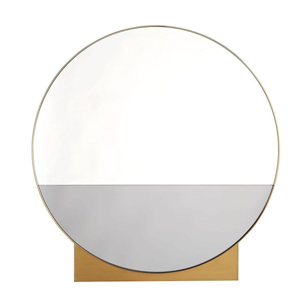 1. Round mirror with clear and smoke glass, antique brass frame, and a wedge-shaped base by Arteriors Home.