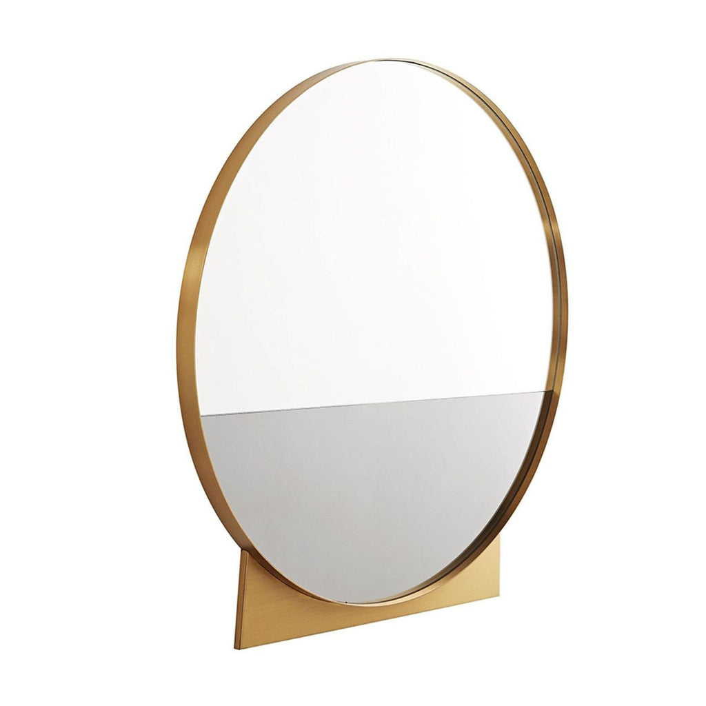 2. Arteriors Home mirror featuring a two-tone design, brass frame, and distinctive wedge detail at the base.