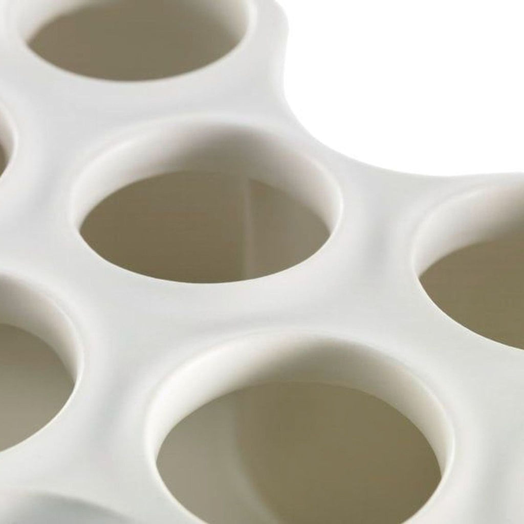 Close-up of the handcrafted Vitra vase, showing the smooth finish and detail of its eight tube openings.