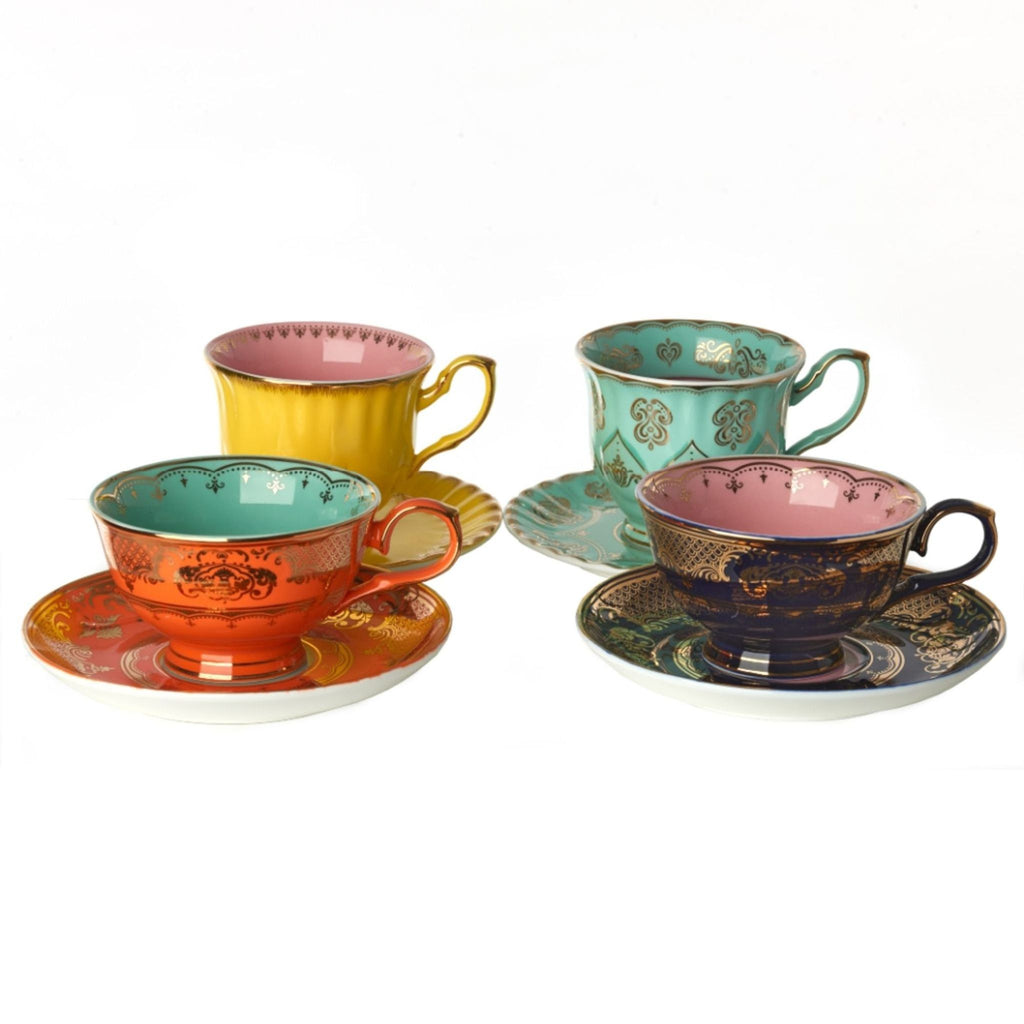 3. Assorted Polspotten bone china teacups and saucers in yellow, turquoise, orange, and navy with gold detailing.