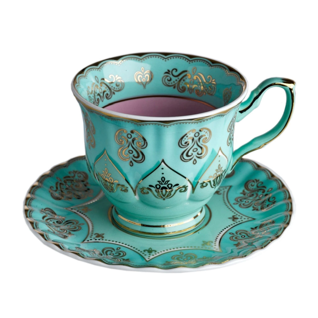 2. Close-up of a turquoise Polspotten bone china cup and saucer with gold decorative patterns.  