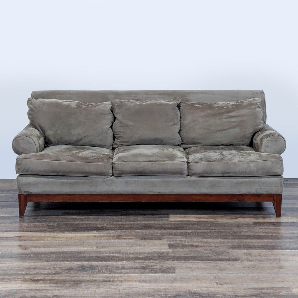 1. Gray Kincaid 3-seat sofa with rolled arms, welted trim, and wooden base, shown from the front.