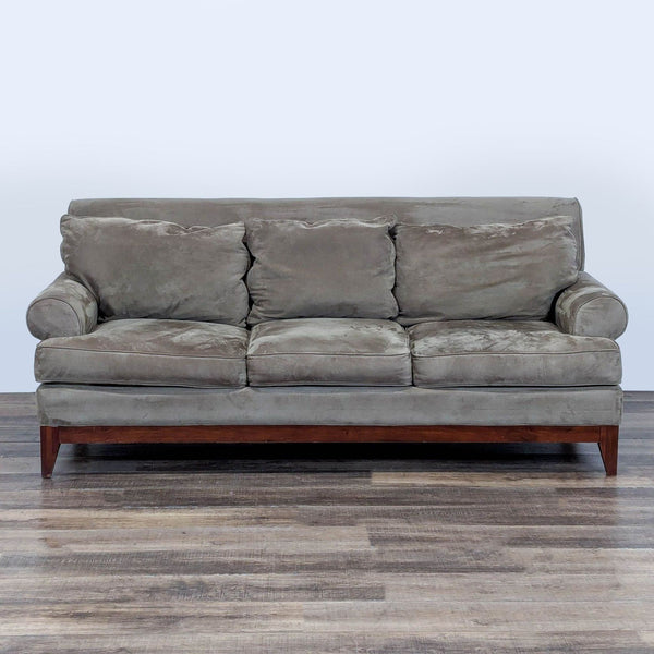 1. Gray Kincaid 3-seat sofa with rolled arms, welted trim, and wooden base, shown from the front.