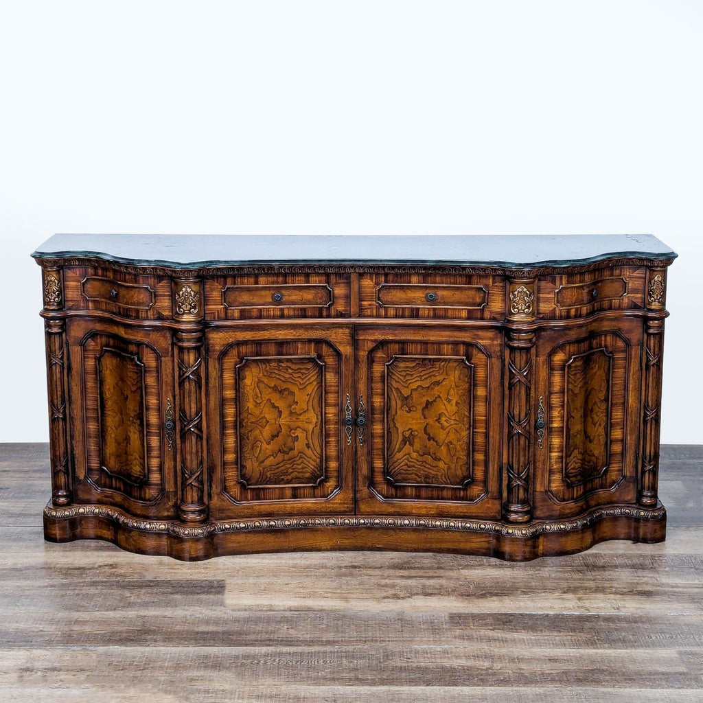 1. Ornate Orleans International sideboard with four drawers, three cabinets, intricate carvings, and burlwood panel doors.