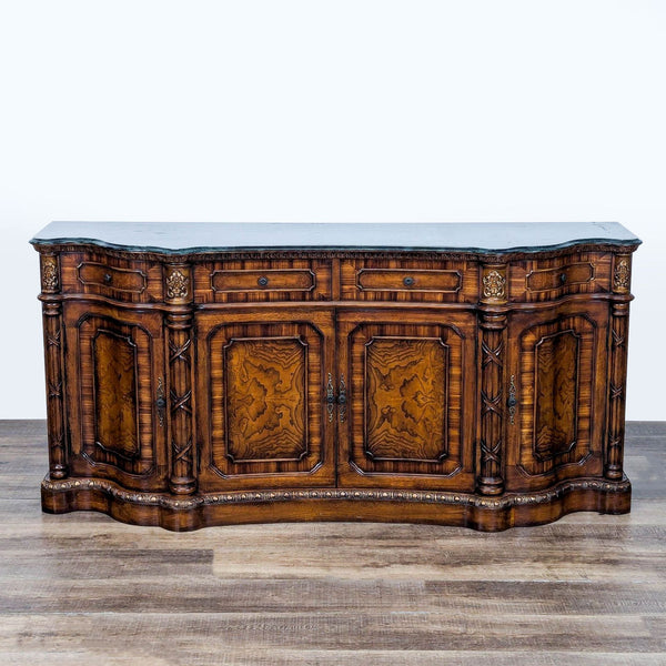 1. Ornate Orleans International sideboard with four drawers, three cabinets, intricate carvings, and burlwood panel doors.