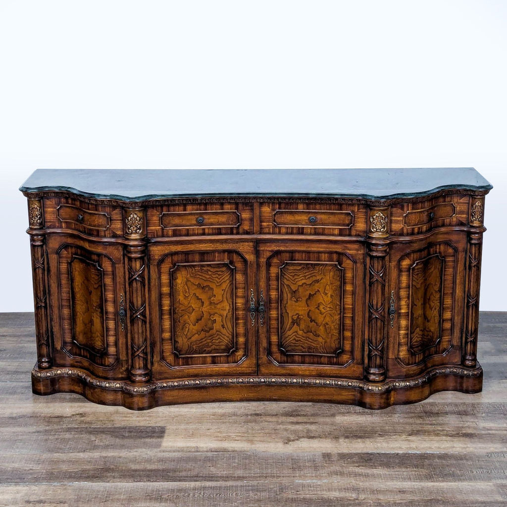 3. Front-facing Orleans International credenza featuring detailed inlay, carved accents, and decorative burlwood panels.
