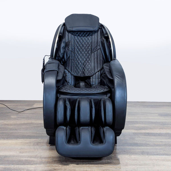 1. Front view of a black Massage Medik zero gravity massage chair with padded seating and elevated leg rests.