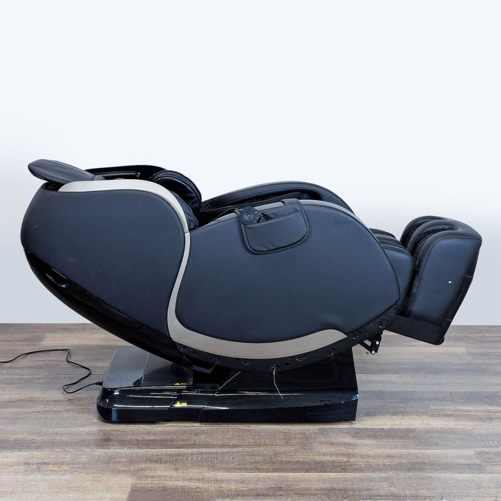 2. Side view of an electric reclining Massage Medik 3D massage chair in zero gravity position on a wooden floor.