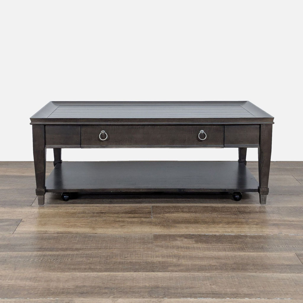 1. La-Z-Boy mahogany coffee table with planked top, storage drawer, lower shelf, and casters for easy movement.