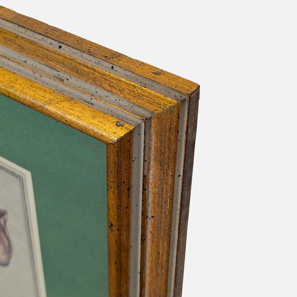 3. Corner detail of the gold wood frame that surrounds the vintage floral print, highlighting its texture.