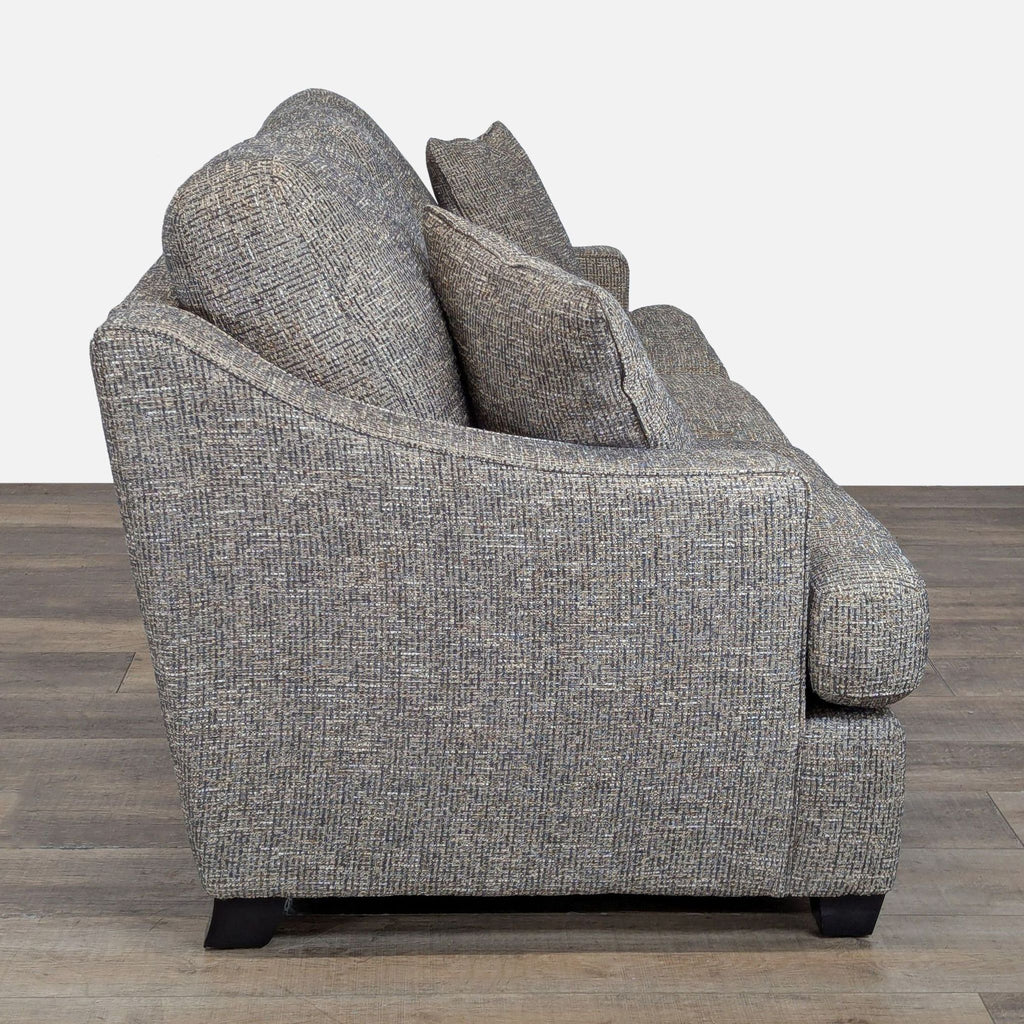 2. Side view showing the sloped arm design and deep cushions of the La-Z-Boy 3-seat sofa.