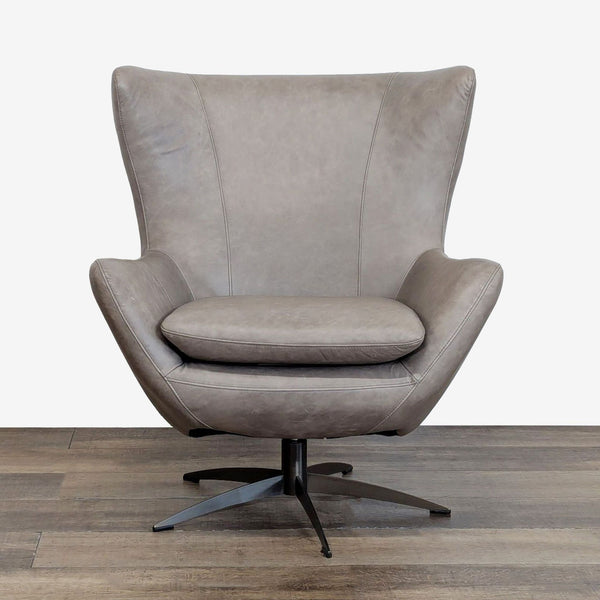 1. Modern lounge chair in taupe leather with a bronze swivel base, Pottery Barn brand, front view.  