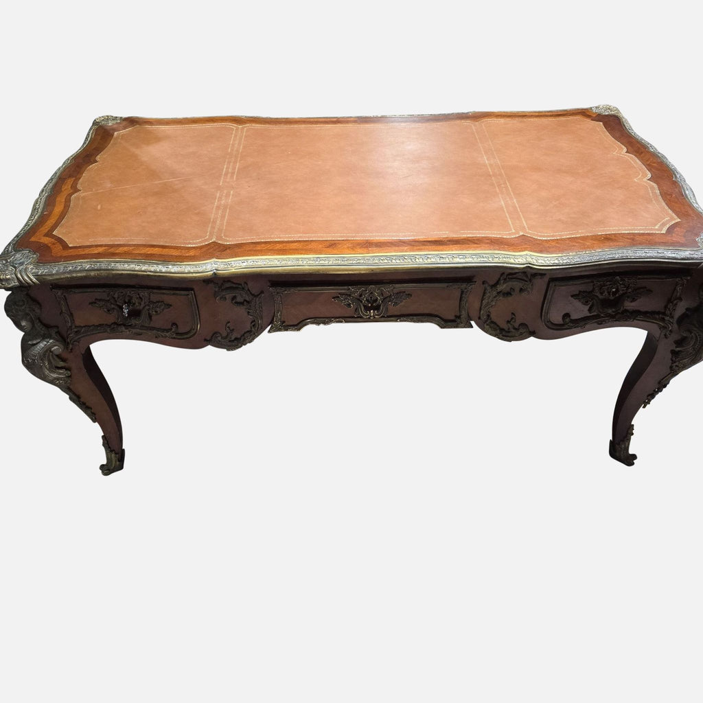 2. Top view of a vintage Reperch desk, showing elegant woodwork, bronze trim, and a spacious embossed leather surface.