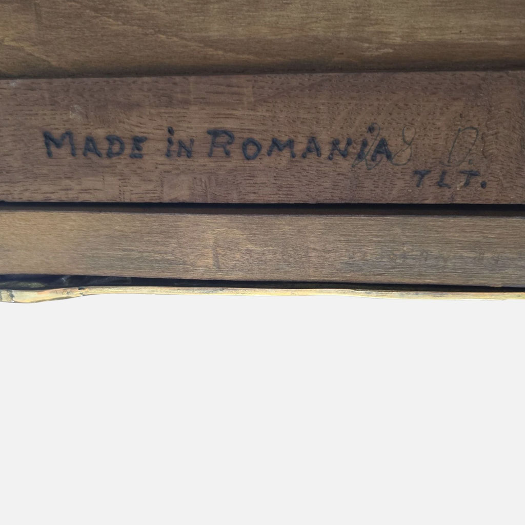 3. Close-up of “Made in Romania” inscribed on wood, indicating the origin of the antique Reperch desk.