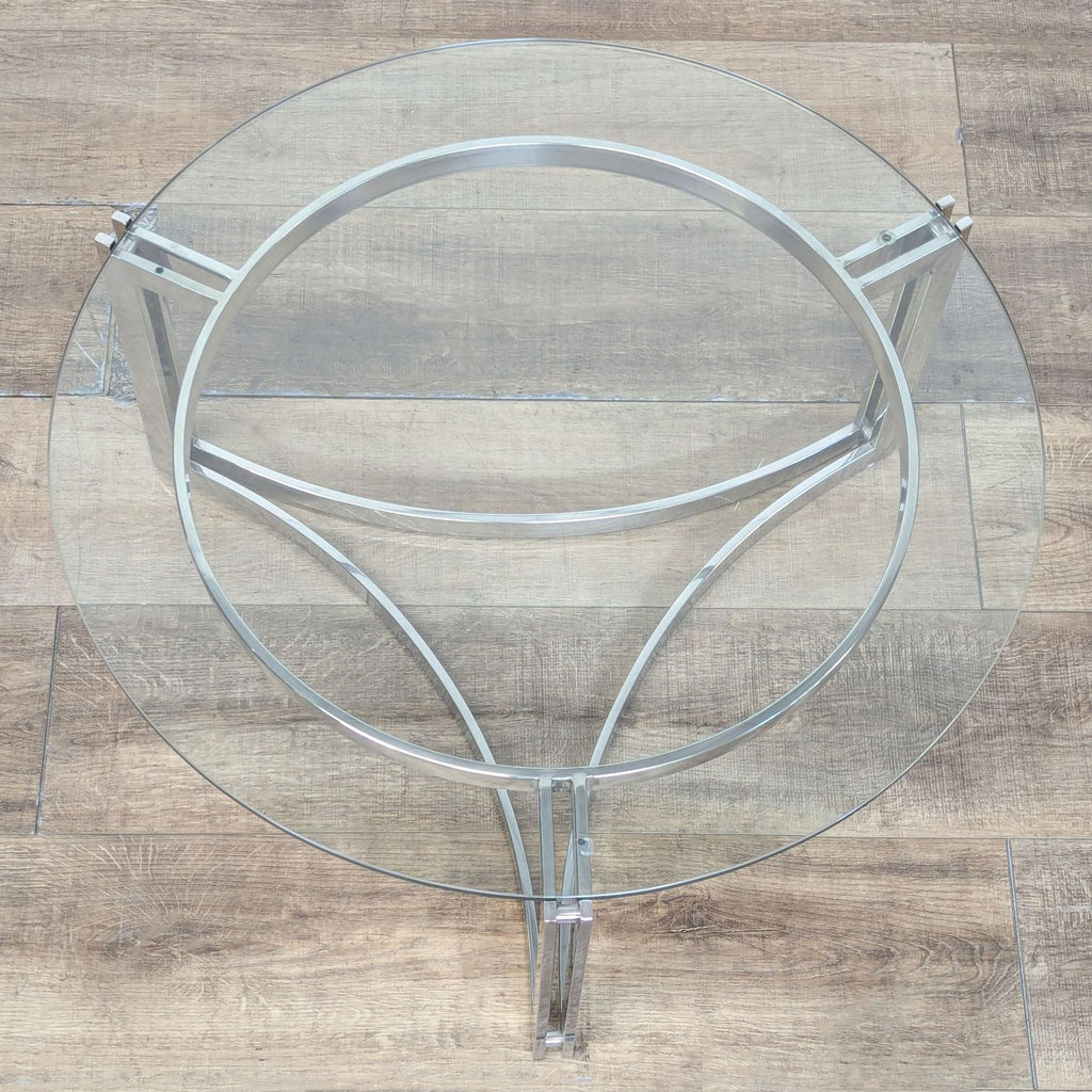 2. Top-down view of Reperch Coffee Table showing the chrome base and circular glass top clearly.  