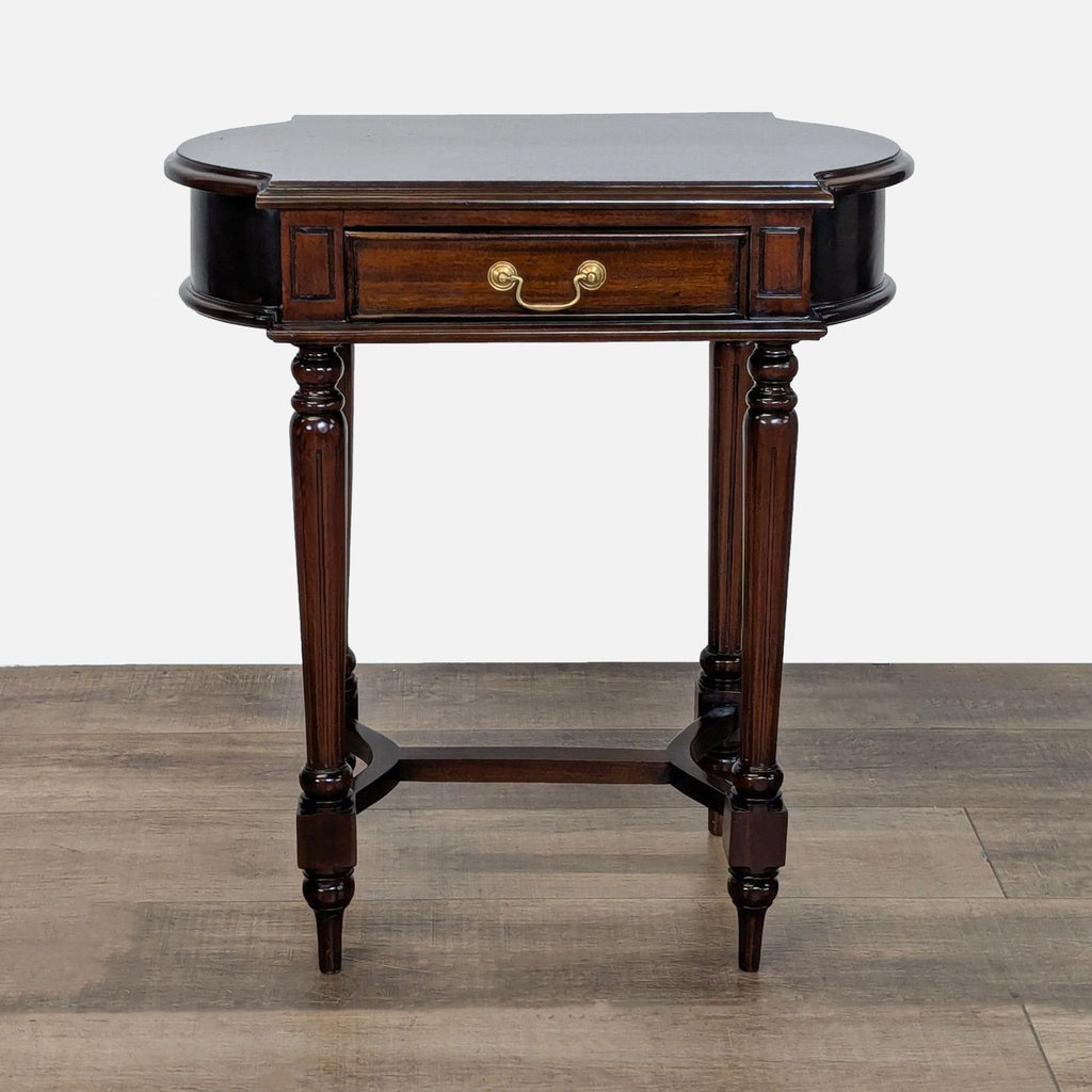 1. Dutch Crafters end table with solid wood, fluted legs, trestle base, and mahogany finish, drawer closed.