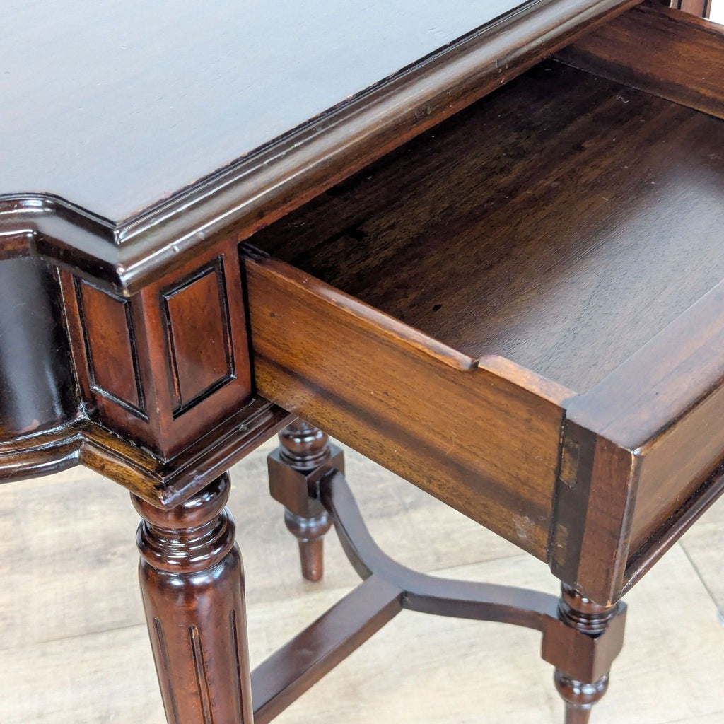 3. Close-up of Dutch Crafters end table drawer, highlighting mahogany wood grain, fluted legs, and craftsmanship.