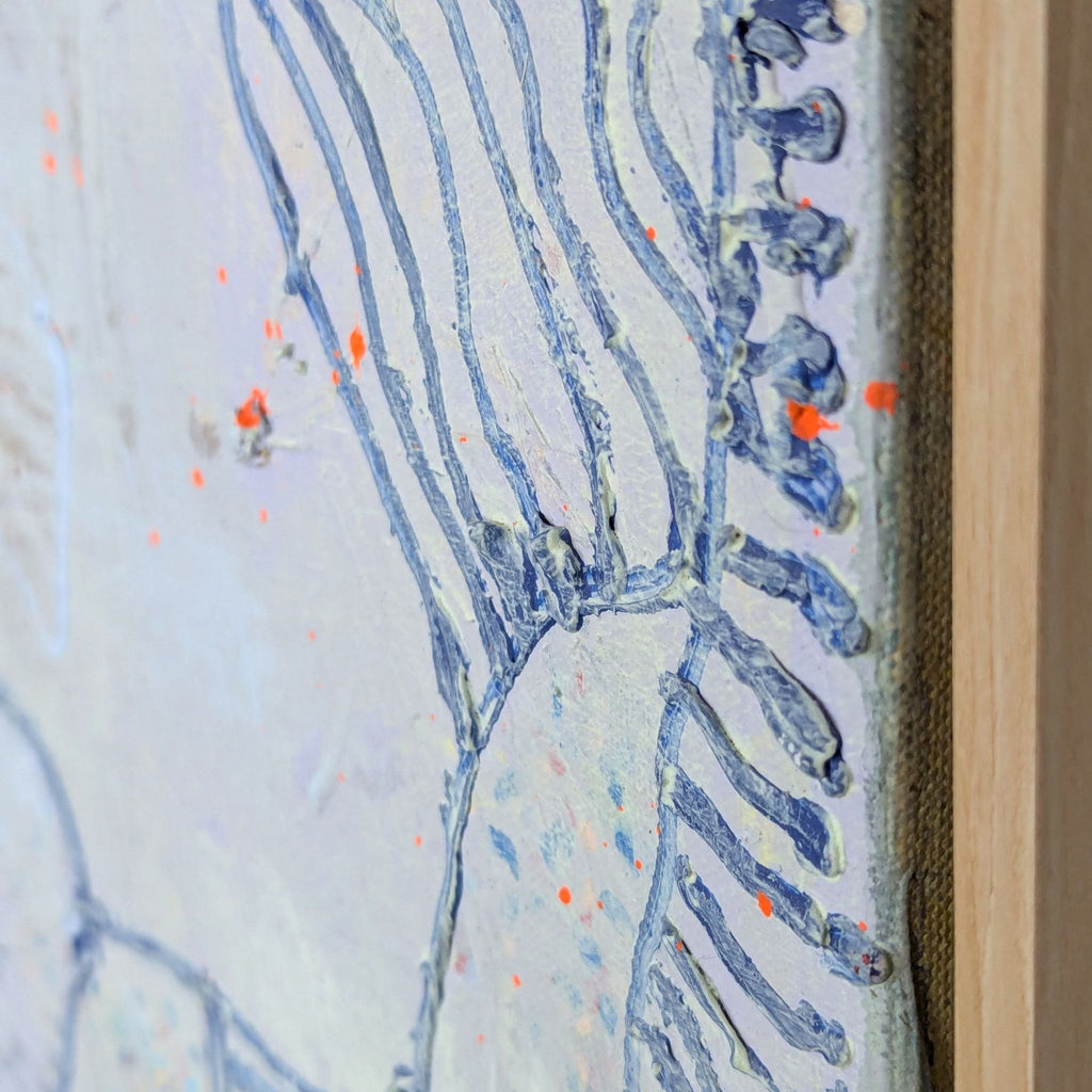 Detail of the canvas edge, showing thick blue lines, tactile paint texture, and orange paint flecks.